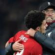 Liverpool's Curtis Jones is congratulated by Jurgen Klopp after scoring the winning penalty against Arsenal