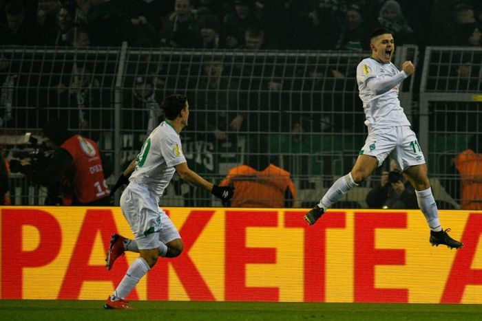 Werder Bremen forwards Milot Rashica (R) and Max Kruse (L) scored all their sides goals in a shock 3-1 Bundesliga win at Bayer Leverkusen on Sunday.