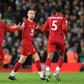 Liverpool celebrate their equaliser against Tottenham at Anfield