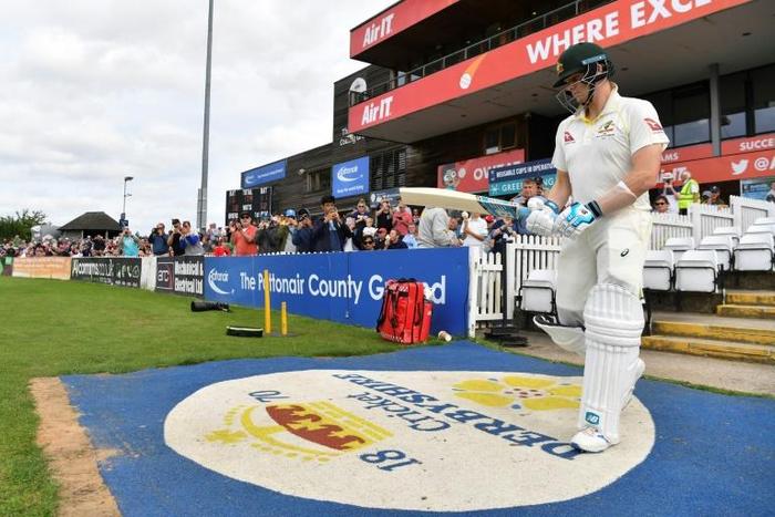 On his way in - Australia star Steve Smith walks out to bat against Derbyshire