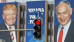This picture shows an Israeli election banner with pictures of US President Donald Trump (L) and Israeli Prime Minister Benjamin Netanyahu hanging on the facade of a building in Jerusalem -- the two are close allies