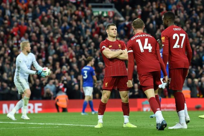 James Milner (centre) celebrates his late winner for Liverpool against Leicester