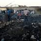 Foreigners in Marabastad, in the Pretoria area, try to save their belongings after their shacks were set alight in last month's attacks