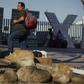 A migrant from Honduras waits at the Mexico-United States border crossing in Tijuana, Mexico on September 12