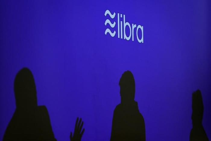 Executives involved with Facebook's proposed Libra digital currency say they will work with regulators to address their concerns