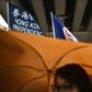 A flag that reads "Hong Kong Independence" is seen alongside the territory's British colonial-era flag and the pro-independence 'Estelada' Catalan flag during a march in Hong Kong on China's national day