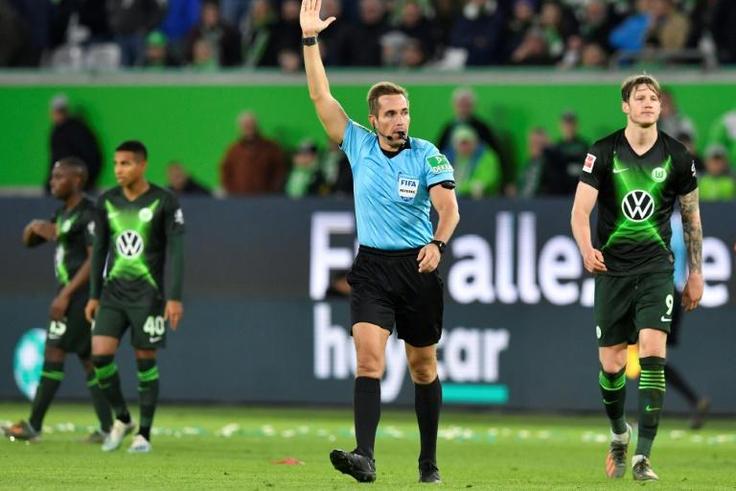 German referee Tobias Stieler overturning Wolfsburg's goal