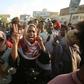 Sudanese demonstrators march during a protest in Khartoum urging the country's new authorities to dissolve the former ruling party of ousted Islamist leader Omar al-Bashir