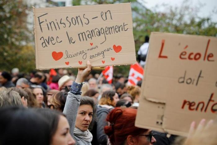 Thousands of French teachers demonstrated in solidarity with a principal who committed suicide after complaining about a work overload leaving her 'exhausted'
