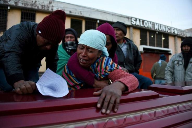 Relatives of one of the victims of a deadly hit-and-run accident in Guatemala's western Nahuala municipality