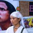 Pinnapha Phrueksapan, widow of ethnic Karen leader "Billy" Por Cha Lee Rakcharoen, stands beside his portrait following a ceremony in Bangkok in September 2019