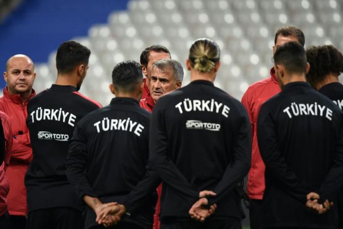 Turkey coach Senol Gunes speaks to his players ahead of their Euro 2020 qualifier against France on Monday, which will be played against a tense diplomatic backdrop