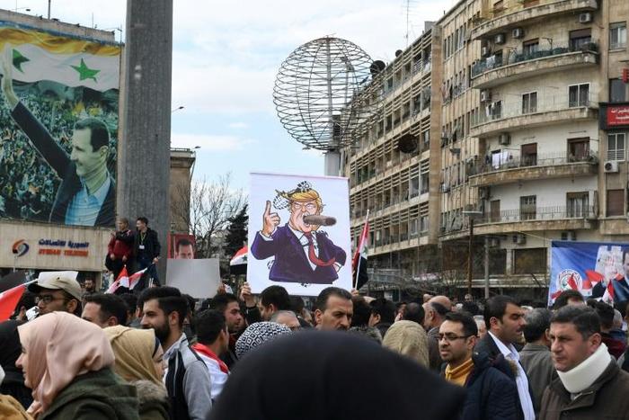 Syrians protest in the northern city of Aleppo against the US decision to recognise Israel's sovereignty over the Golan Heights