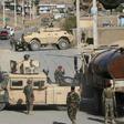 Afghan National Army soldiers stand guard and inspect the site of a suicide car bomb attack by the Taliban in Char Asiab district, south of Kabul, on September 12