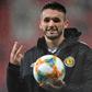 Scotland midfielder John McGinn poses with the match ball after scoring three against San Marino