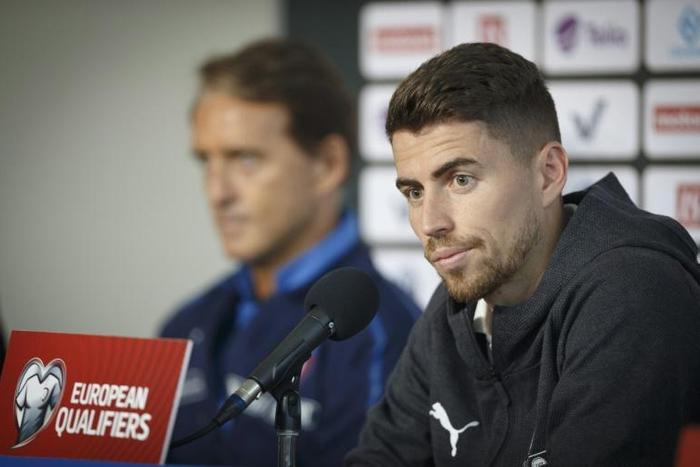 Italy head coach Roberto Mancini (L) and midfielder Jorginho at a press conference in Tampere, Finland before their Euro 2020 qualifier