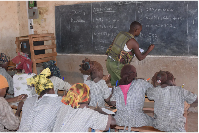Police officer dumps his gun to teach mathematics as teachers fail to show up over insecurity