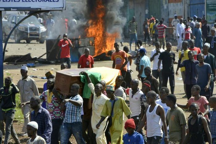 Violence erupted after hundreds marched in the capital Conakry to accompany coffins of people killed in more than a week of demonstrations