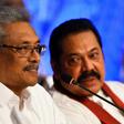 Sri Lankan presidential candidate Gotabhaya Rajapakse (left) with his brother, former president Mahinda Rajapakse during a press conference in Colombo