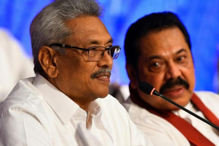 Sri Lankan presidential candidate Gotabhaya Rajapakse (left) with his brother, former president Mahinda Rajapakse during a press conference in Colombo