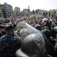 Riot police deployed after counter-demonstrators wielding sticks and throwing stones attacked the Beirut protest site
