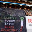 Supporters hold a banner calling for Iranian women to be allowed to enter football stadiums, during a match between Sweden and Iran near Stockholm in March 2015