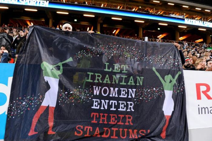Supporters hold a banner calling for Iranian women to be allowed to enter football stadiums, during a match between Sweden and Iran near Stockholm in March 2015