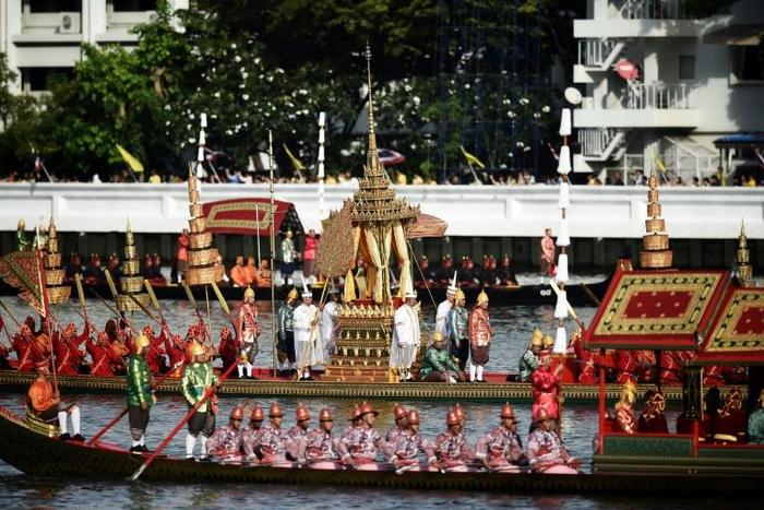 Thai oarsmen row during the first full dress rehearsal for the Royal barge ceremony along the Chao Phraya river in Bangkok