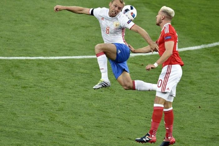 Russia international Denis Glushakov (left) scored the only goal as Spartak Moscow beat nine-man Rostov 1-0 to go top of the Premier League