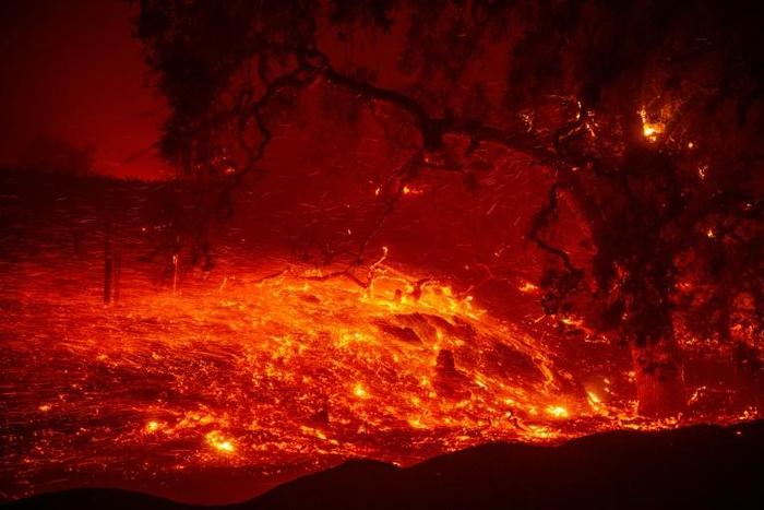 Embers blow in the wind during the Kincade Fire near Geyserville, California on October 24, 2019