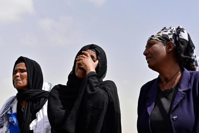 Grief: Relatives arrive at the site