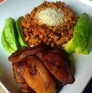 Gari and beans served with fried plantain and avocado