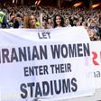 Supporters hold a banner calling for Iranian women to be allowed to enter football stadiums, during a match between Sweden and Iran in Solna near Stockholm in March 2015