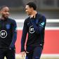 Friends turned foes: England teammates Raheem Sterling (left) and Trent Alexander-Arnold (right) will face off on Sunday