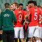 England players speak with the officials during a stop in play due to racist abuse