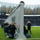 Volunteers prepare to knock down a mock-up of the former Berlin Wall bearing the inscription "Against Walls together with Berlin", before the Bundesliga match between Hertha Berlin and RB Leipzig on Saturday.