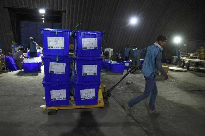 The young employees at Afghanistan's Independent Electoral Commission are rushing through final preparations for the vote, set for September 28