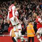 Top Gunner: Pierre-Emerick Aubameyang (right) celebrates scoring the winner in a thrilling 3-2 victory over Aston Villa