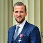 Harry Kane poses with his MBE award at Buckingham Palace