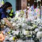 Mourners pay their respects at the site where a student fell to his death during a recent protest