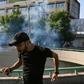 Iraqi security forces fired tear gas to fore protesters away from Baghdad's Green Zone on Saturday morning