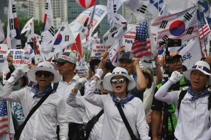 Supporters of South Korea's former president Park Geun-hye rally outside the Supreme Court, which ordered she face a new trial on graft charges
