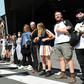 Climate change protesters attempting to blockade a mining conference linked arms in front of mounted police in Melbourne before clashes started