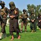 Afghan security personnel escort alleged Islamic State militants during an operation in Jalalabad province in October 2019. Officials say the IS Afghan branch has been defeated in one of the eastern provinces