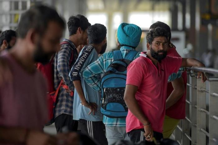 Indian nationals arrive at Indira Gandhi International airport after being deported from Mexico