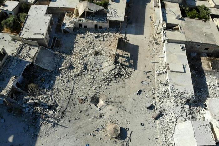 Destruction and damaged buildings from Syrian government forces' bombardment are pictured in Idlib province, where close to 1,000 civilians have been killed
