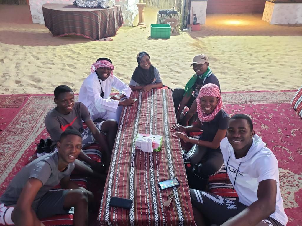 2019 NSMQ champions having fun with quiz mistress in Dubai