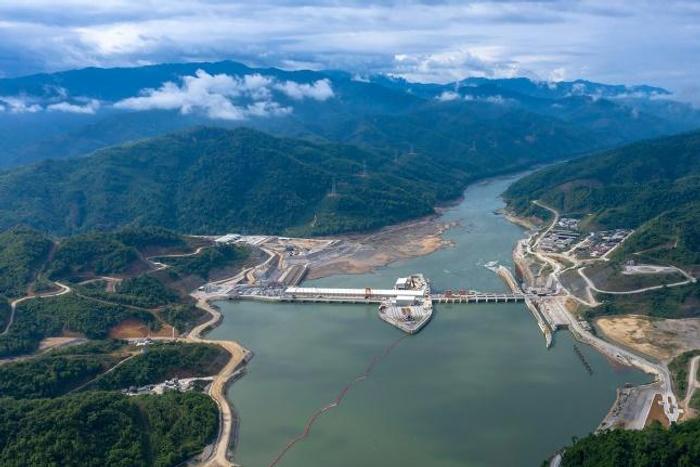 An undated CK Power-issued photo shows shows the Xayaburi dam hydro project on a swollen Mekong river in Laos, but independent images taken downstream paint a different picture