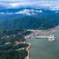 An undated CK Power-issued photo shows shows the Xayaburi dam hydro project on a swollen Mekong river in Laos, but independent images taken downstream paint a different picture