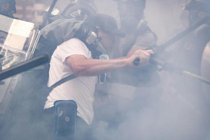 Violence coursed through Hong Kong on National Day, with dozens hurt and more than 150 people arrested